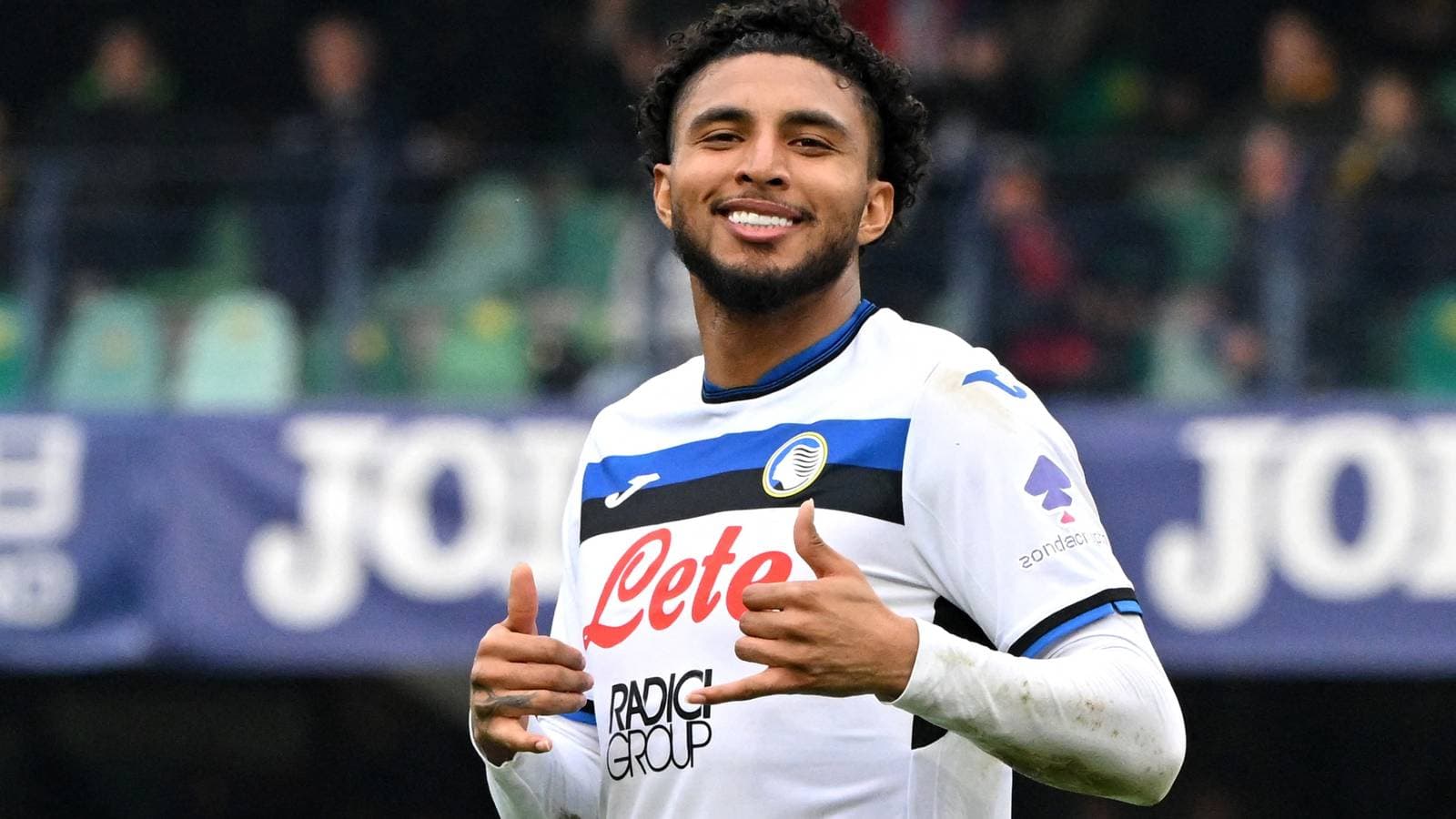 Player celebrating with thumbs up on the field