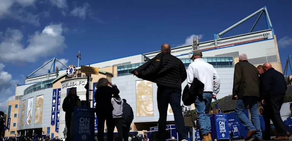 Fans walking towards Chelsea FC stadium entrance