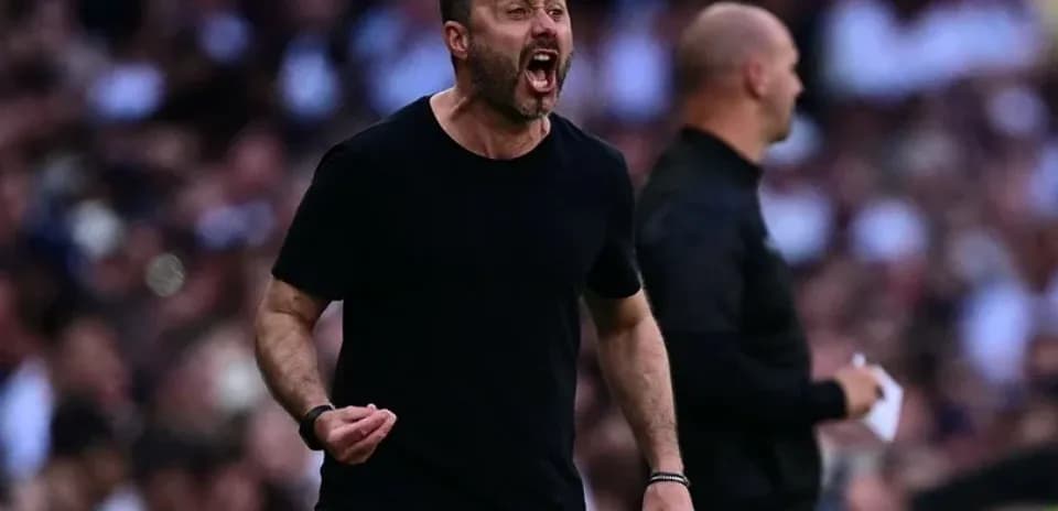 Coach shouting instructions on the sidelines during match