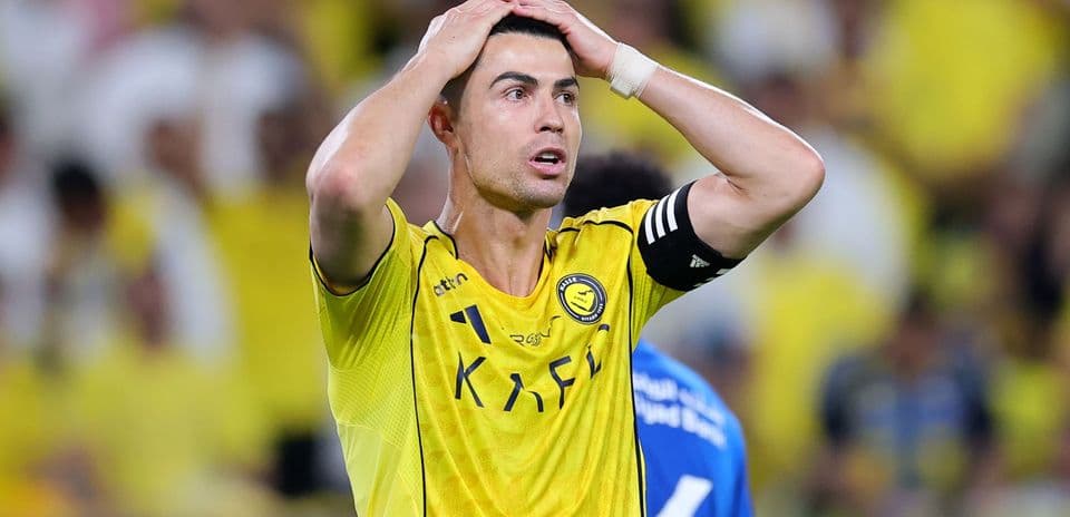 Player in yellow jersey showing frustration during match