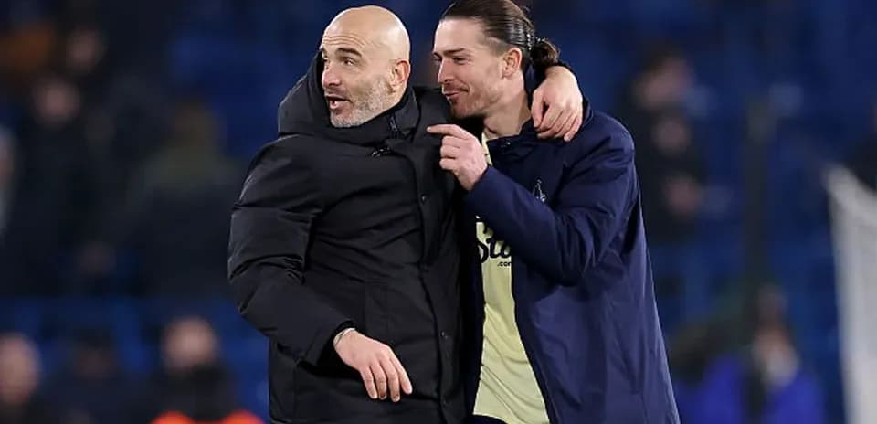 Coach and player celebrating after match conclusion