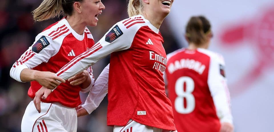 Arsenal W players celebrating a goal during match
