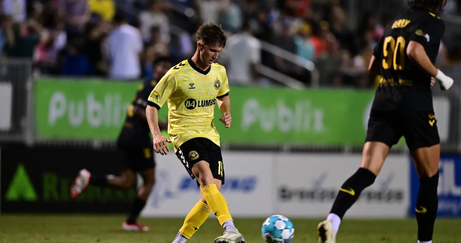 Charleston Battery player kicking the ball