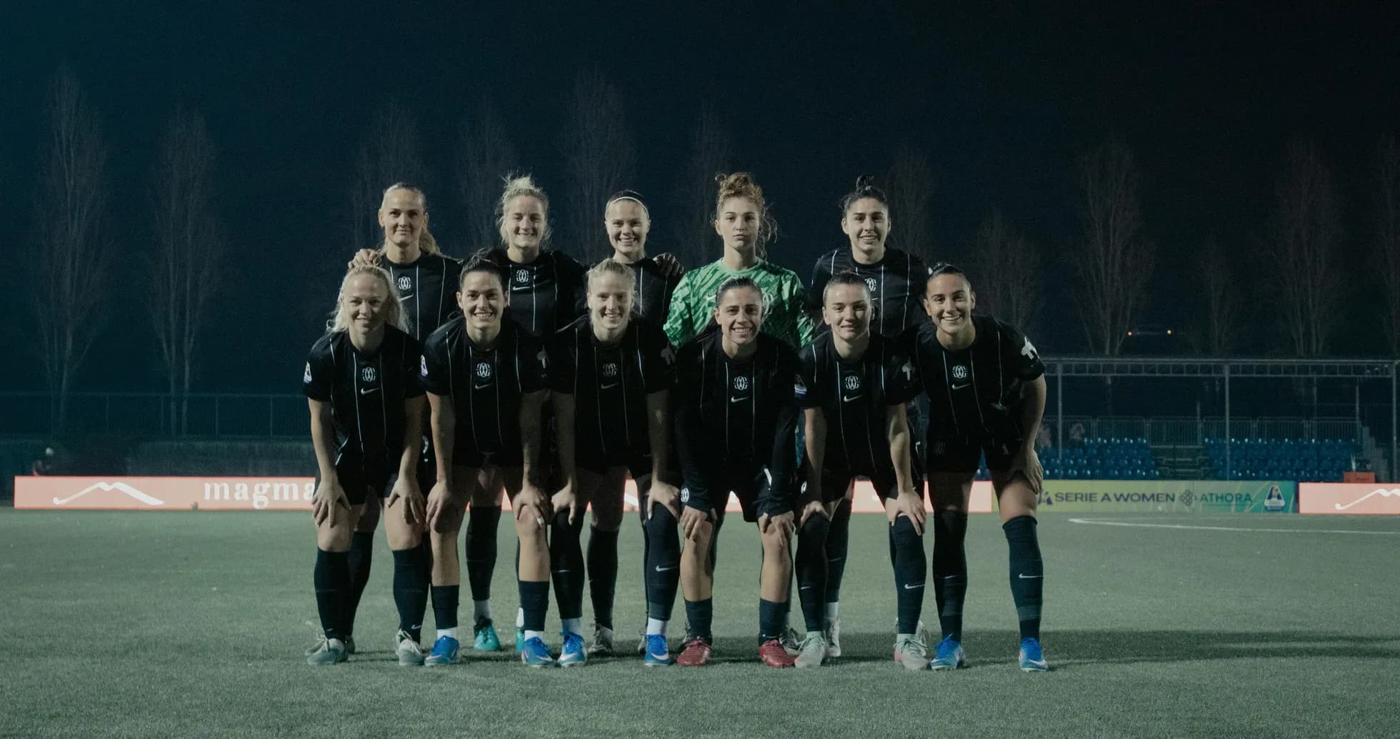 Como W team posing for a group photo