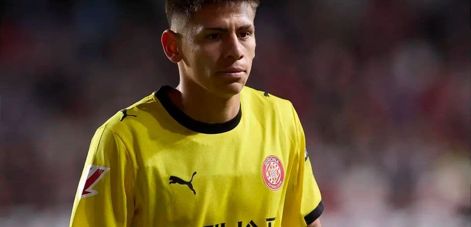 Player in yellow kit walking on the field