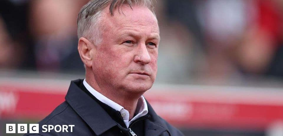 Manager observing match from the sidelines
