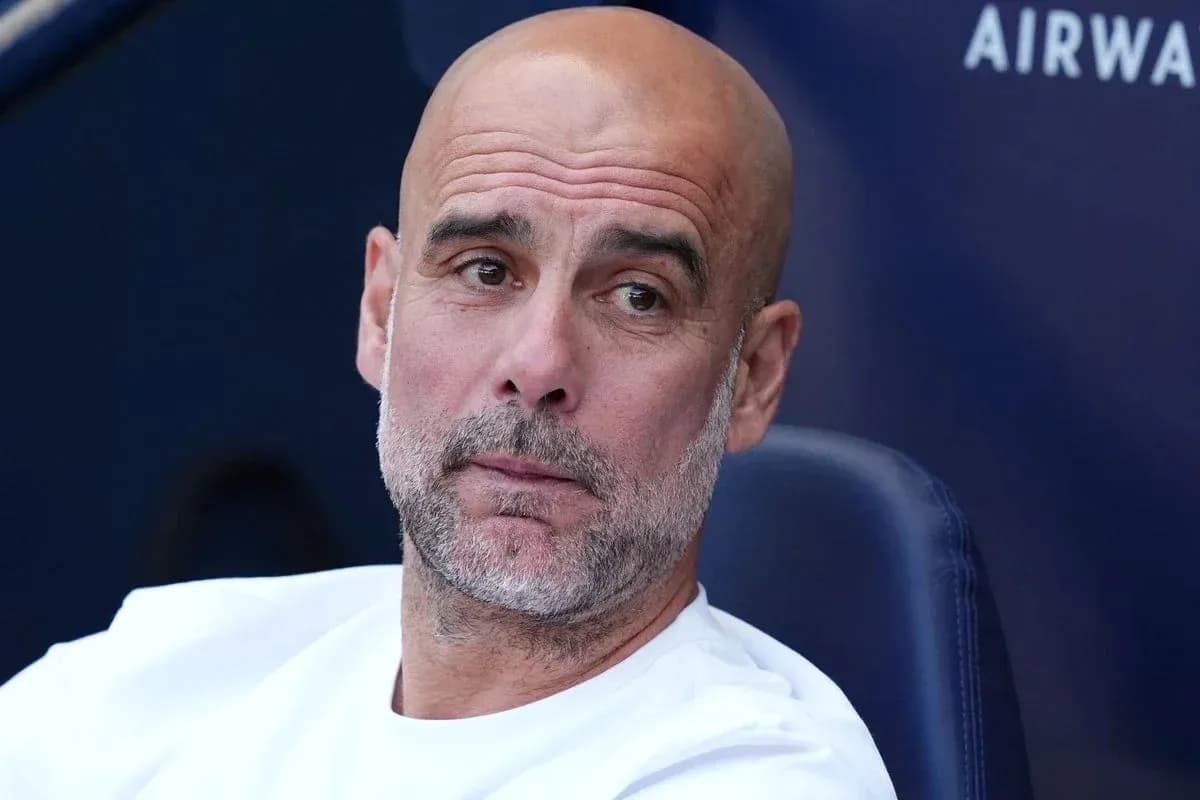 Manager sitting on the bench during a match