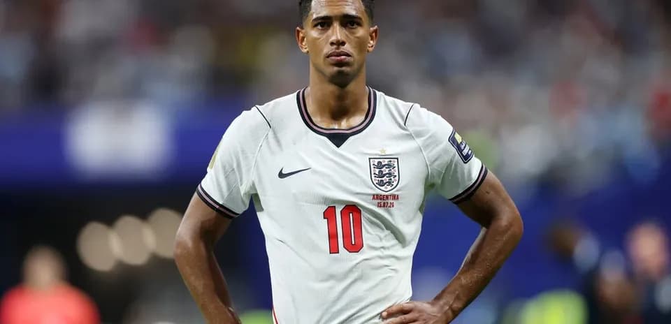 Player in England kit during match with hands on hips