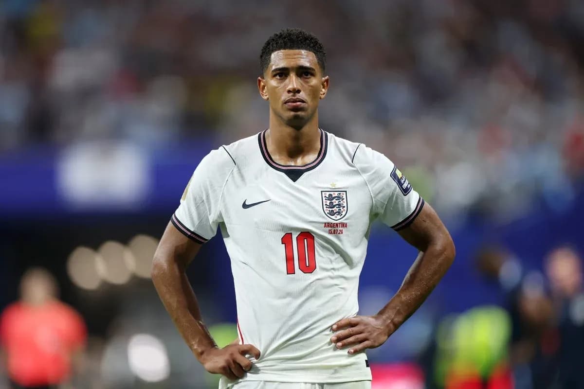 Player in England kit during match with hands on hips