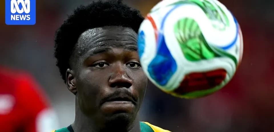 Player watching a soccer ball in mid-air