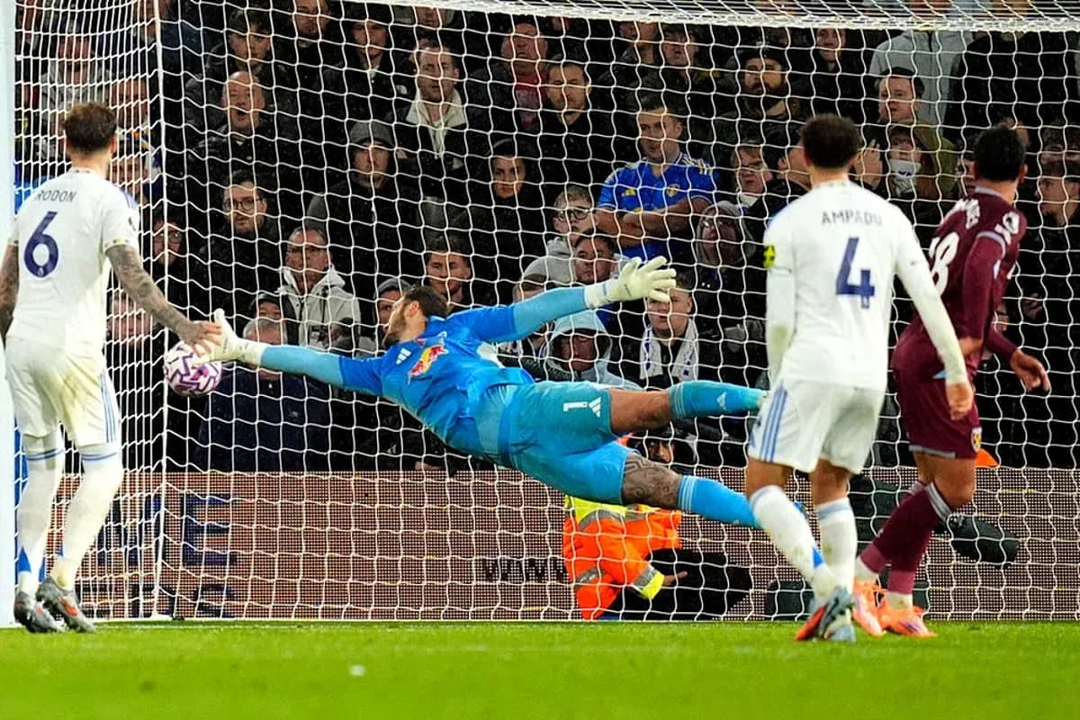 Goalkeeper saves penalty during match action