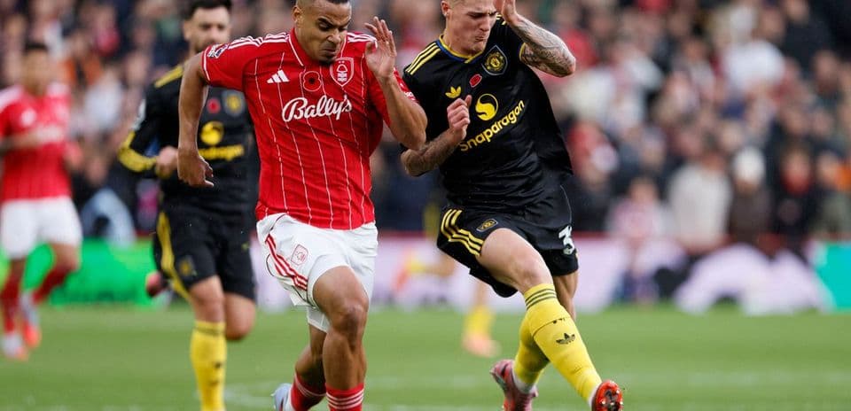 Player competing for the ball in Premier League match