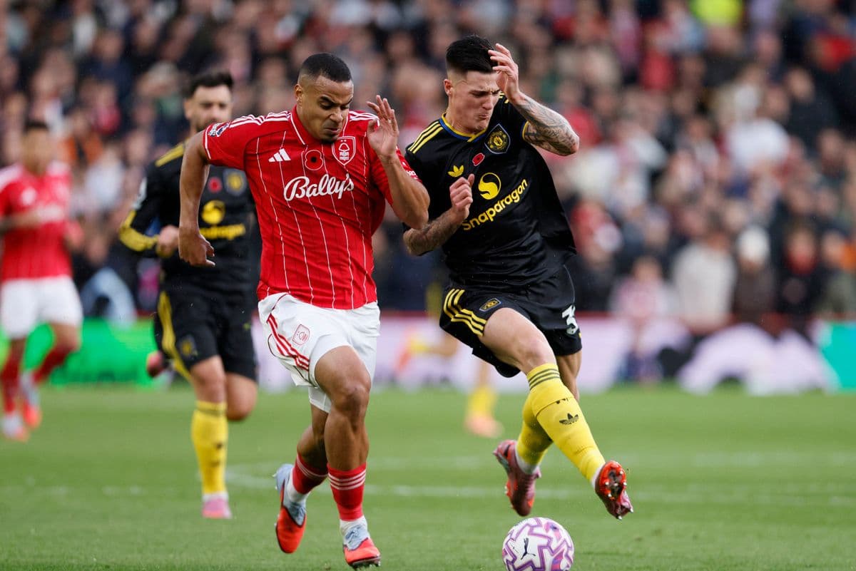Player competing for the ball in Premier League match