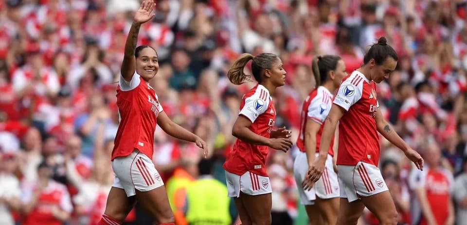 Arsenal players celebrating a goal in a match