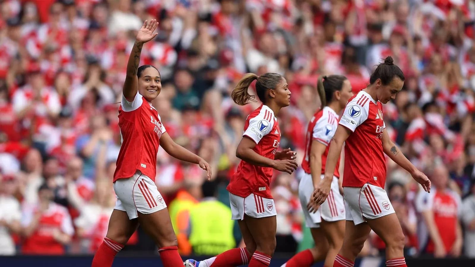 Arsenal players celebrating a goal in a match
