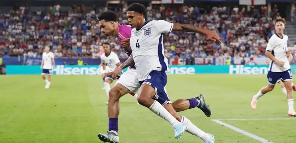 Two players competing for the ball in match