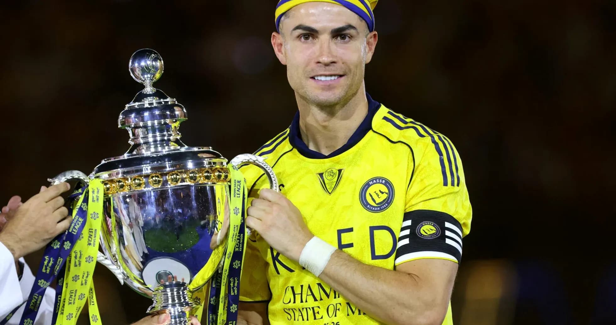 Player holding trophy during victory celebration