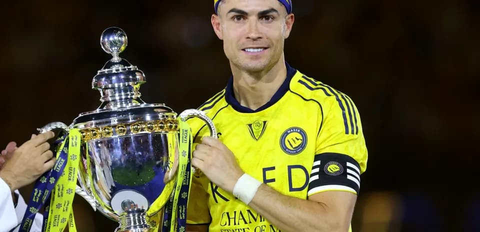 Player holding trophy during victory celebration