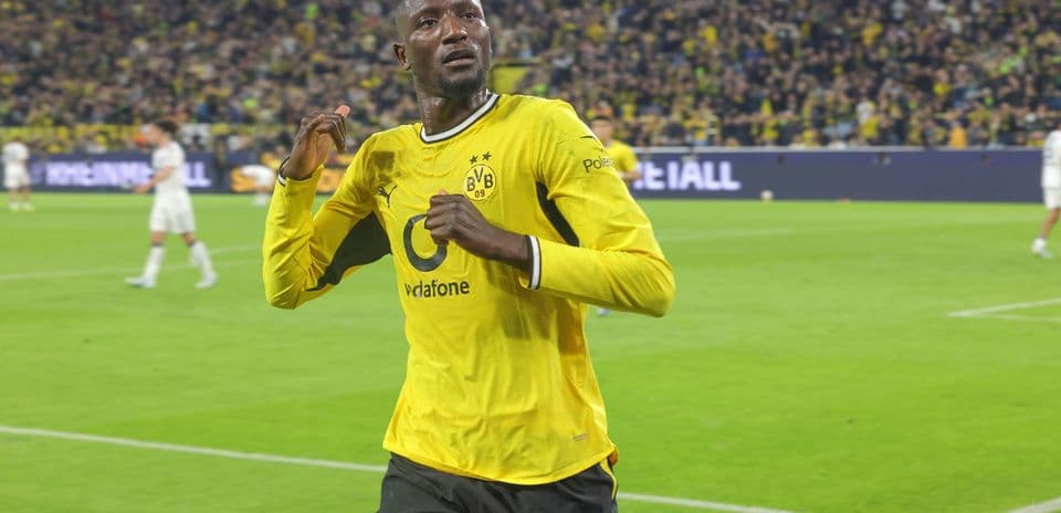Player celebrating after scoring for Borussia Dortmund