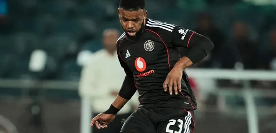Player in black jersey controlling the ball on field