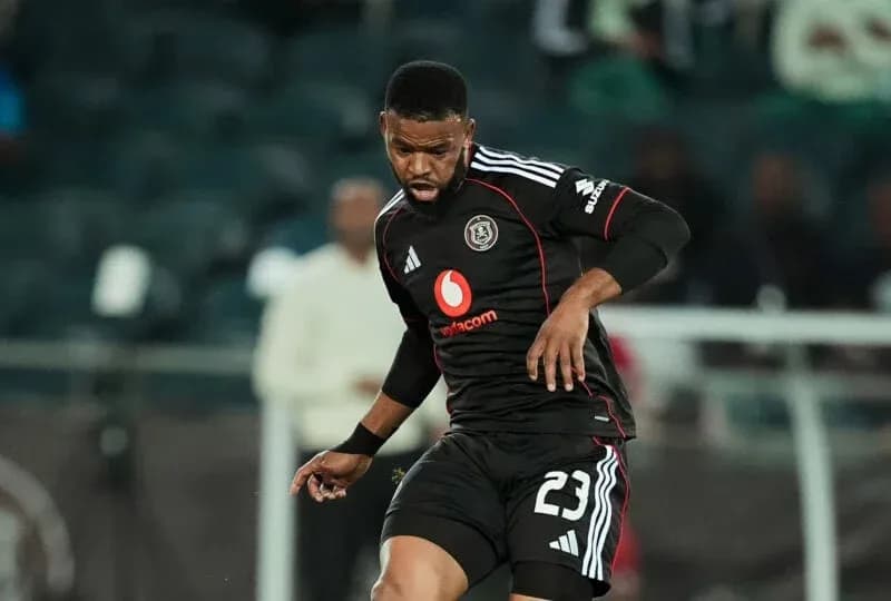 Player in black jersey controlling the ball on field