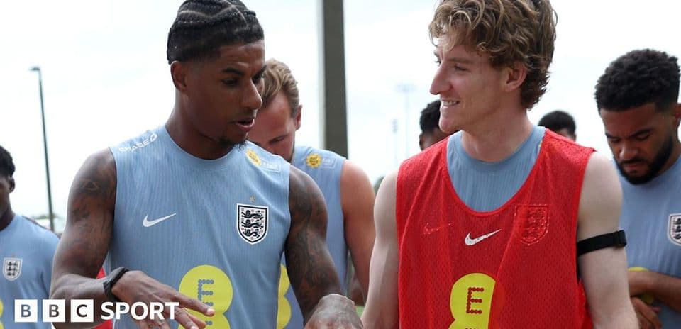 Two players chatting during England training session