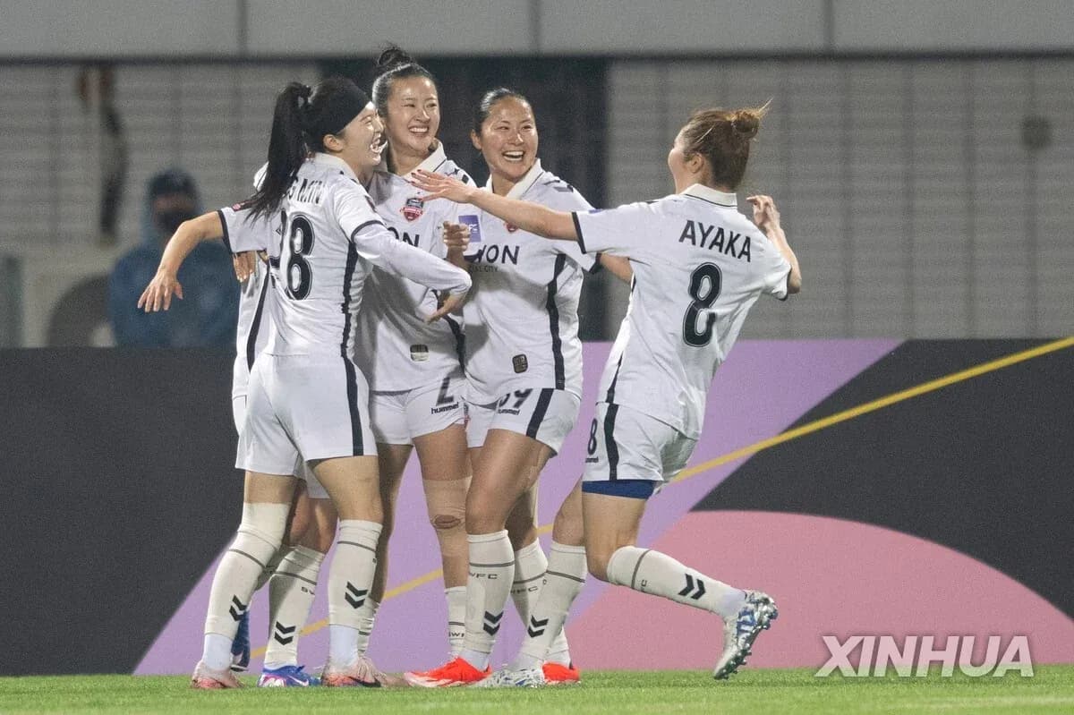 Players celebrating a goal during WK-League match