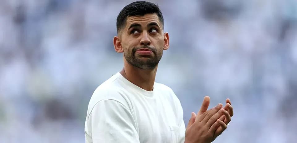 Player clapping during match warm-up on field