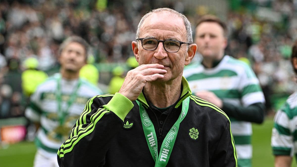 Celtic manager on pitch during post-match celebration