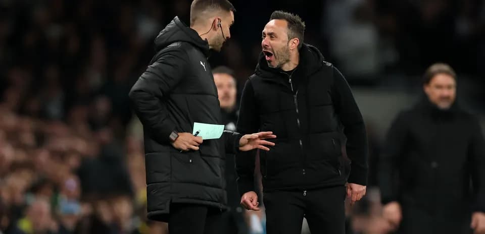 Coaches discussing strategies during a match