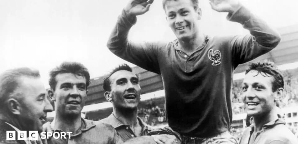 Players celebrating a victory with teammate on shoulders