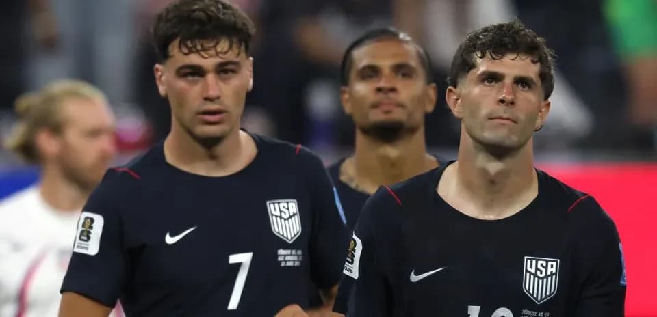 US men's soccer players walking off the field