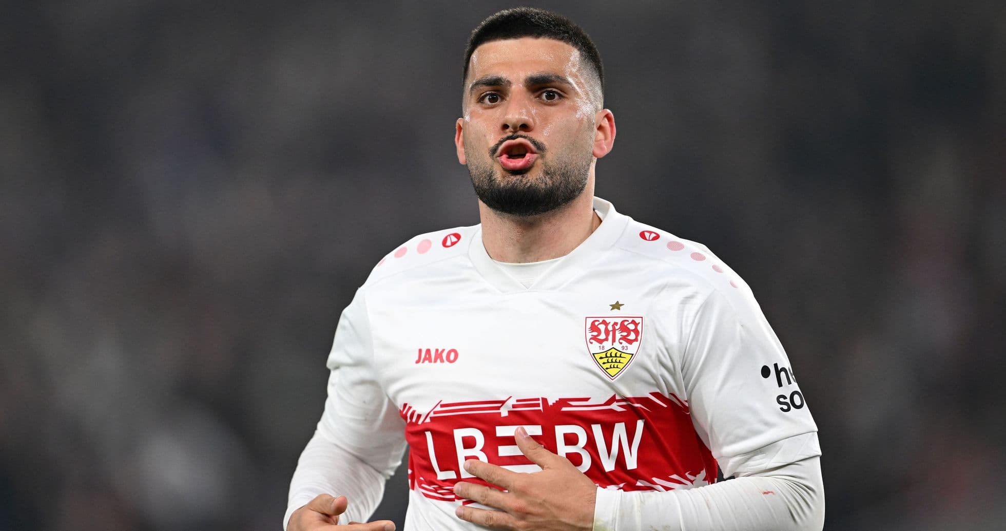 Player gesturing during match in Stuttgart jersey