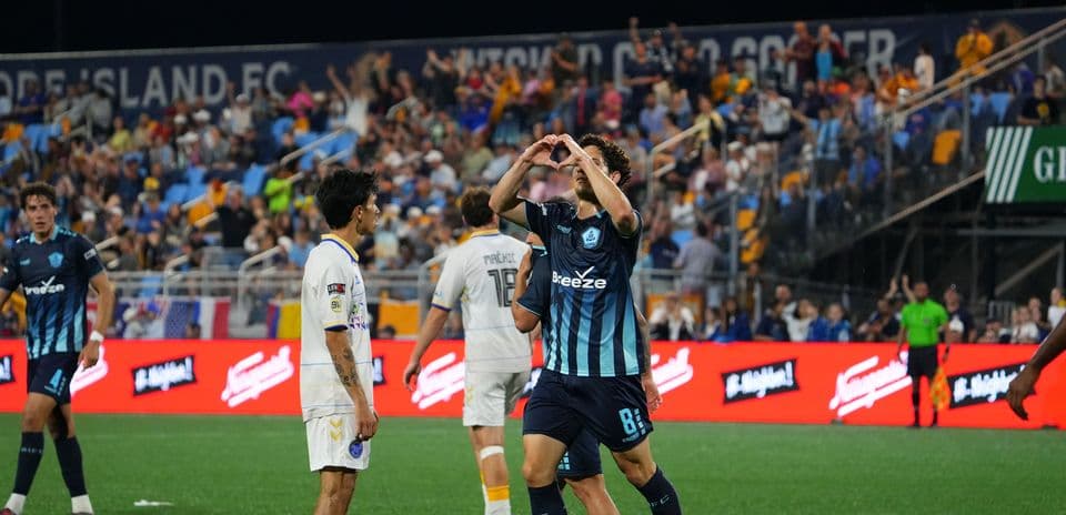 Player celebrating after scoring goal in match