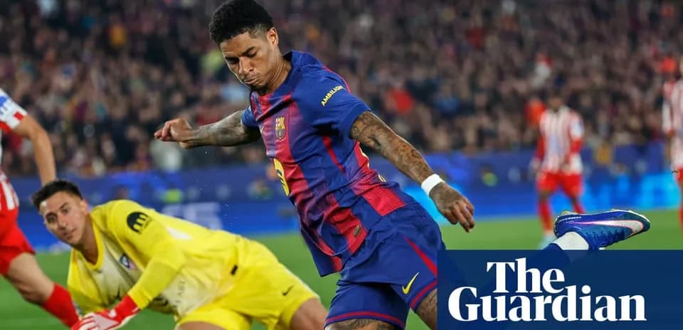 Barcelona player shooting on goal with goalkeeper ready