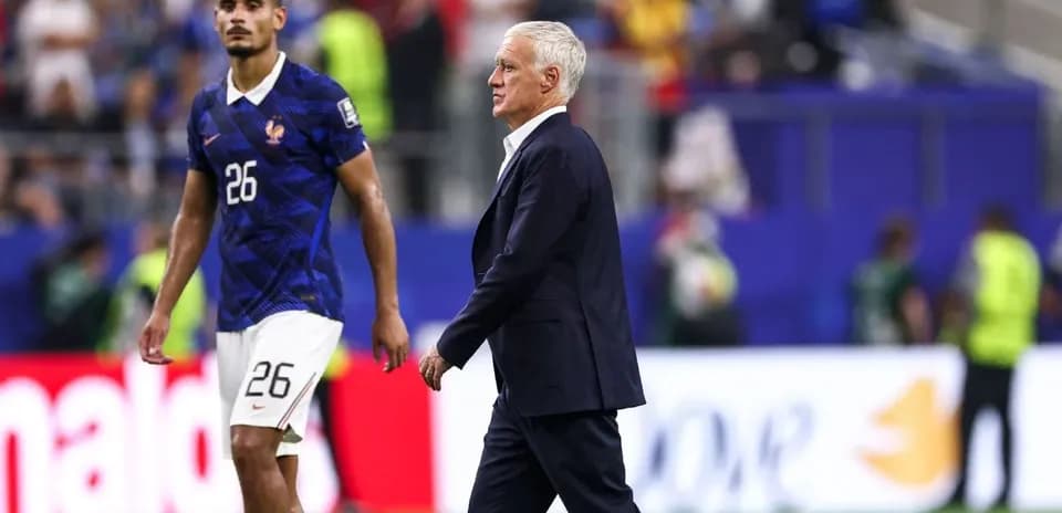 Coach walking past player on the field
