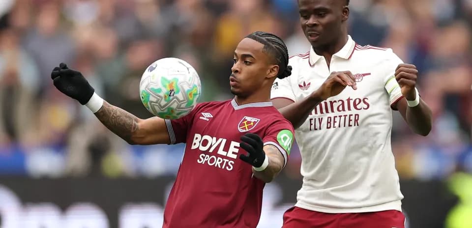 West Ham and Arsenal players competing for the ball