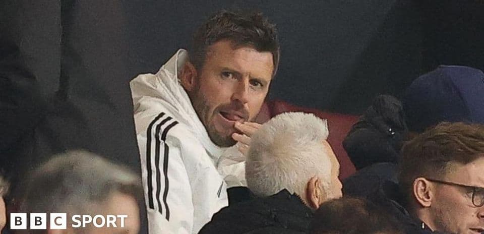 Person in white jacket sitting in audience