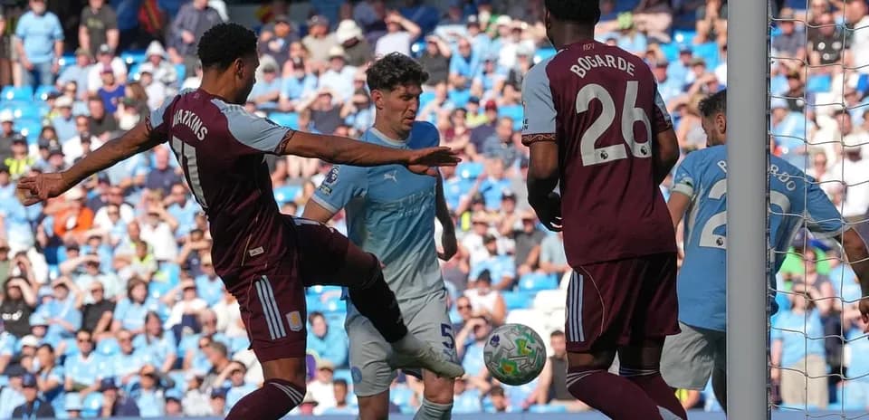 Watkins challenging for the ball in Premier League match