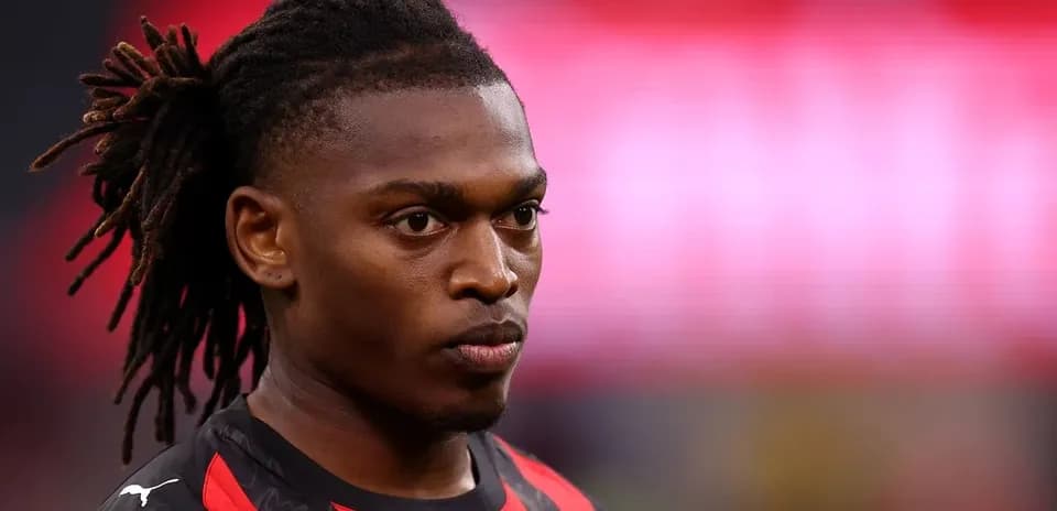 Player with dreadlocks in team jersey on field