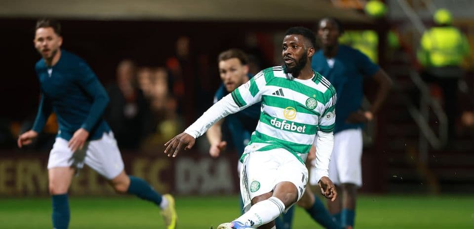 Celtic player dribbling during match with opponents