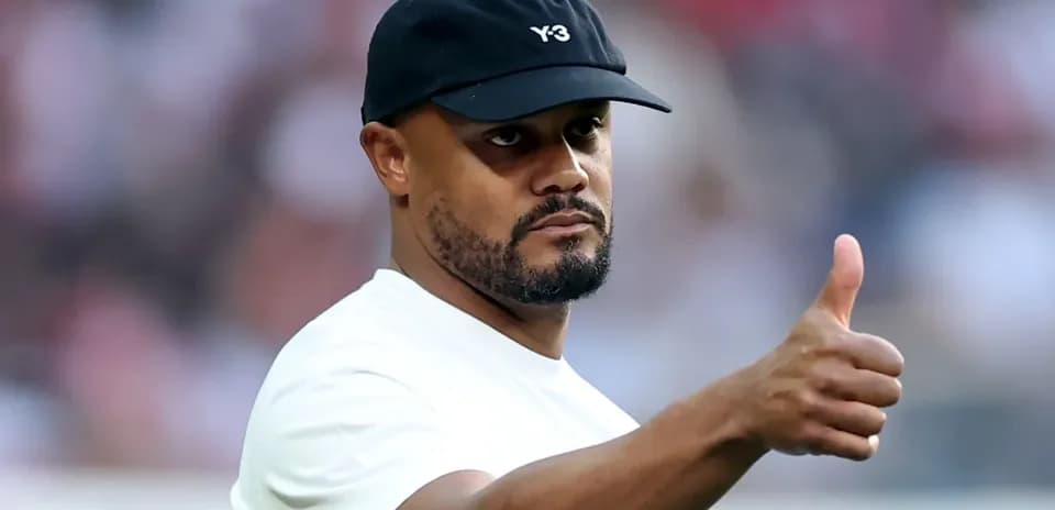 Man giving a thumbs up in sports attire