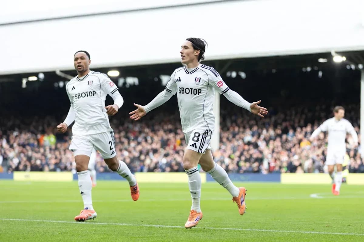 Fulham players celebrating a goal on the pitch