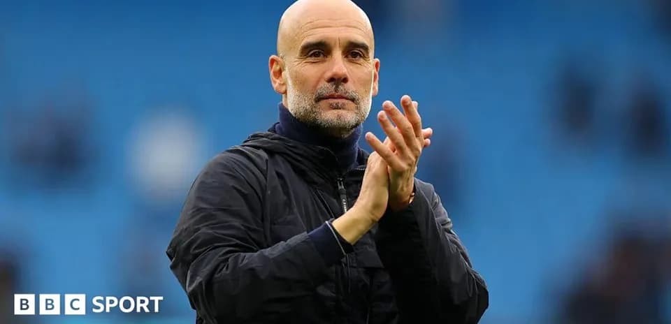 Coach applauding during match at stadium