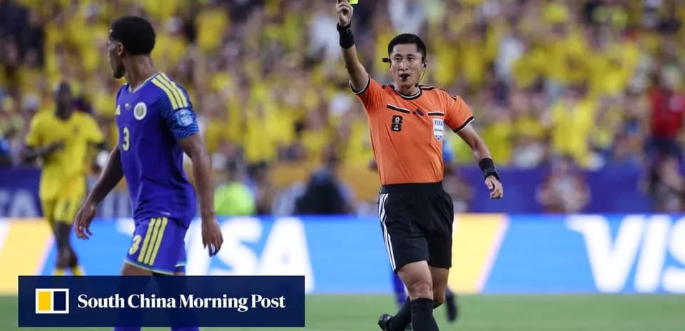 Referee showing a yellow card to player during match
