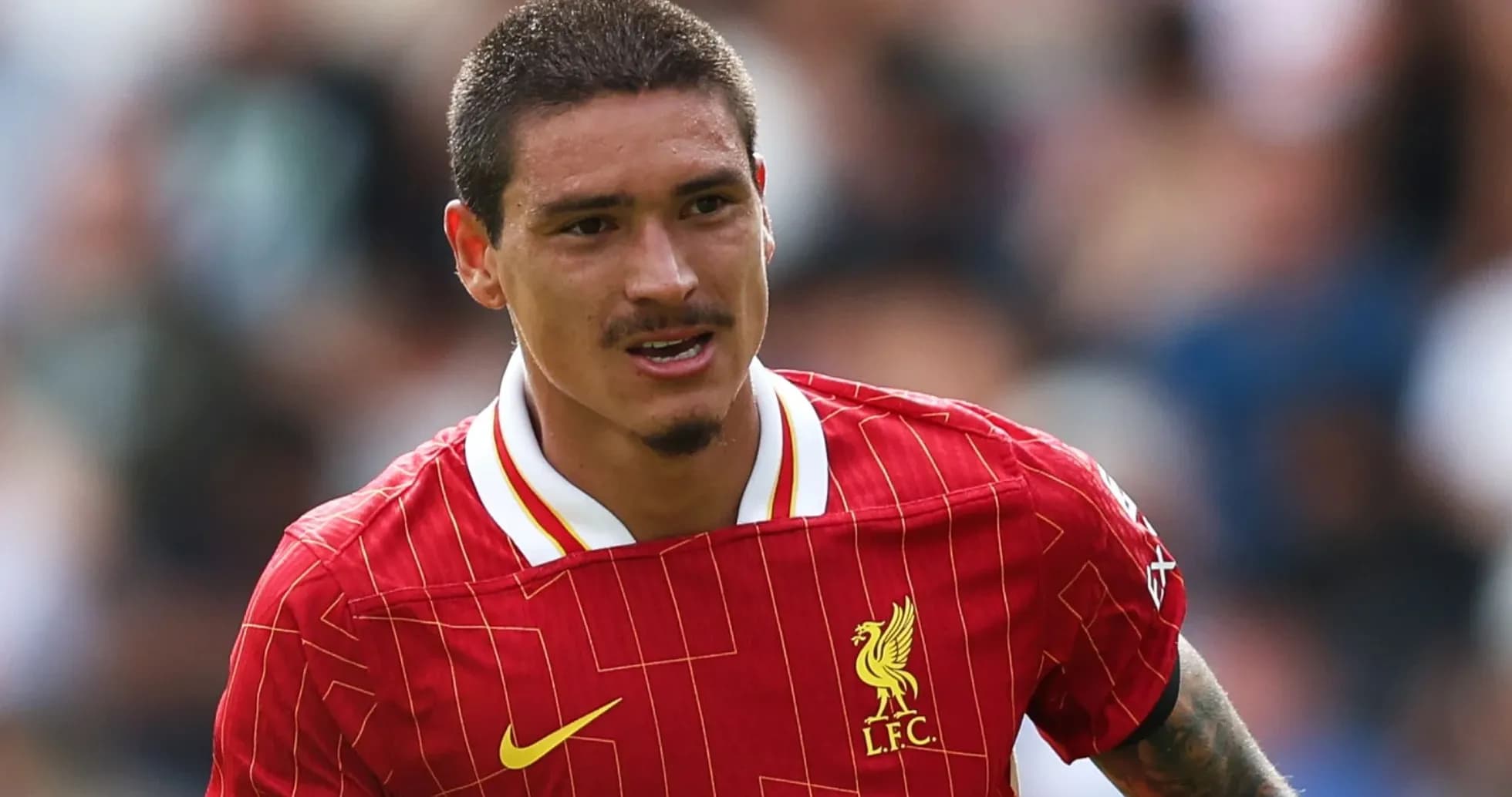 Player wearing Liverpool kit during a match