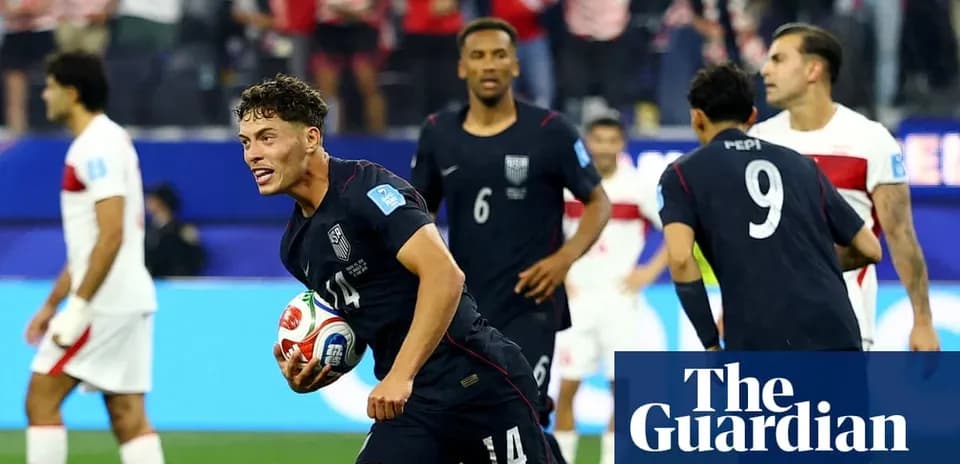 US player celebrating with soccer ball after scoring