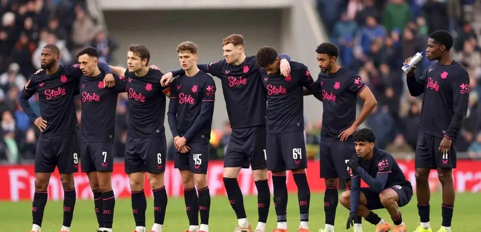 Everton players standing together before the match