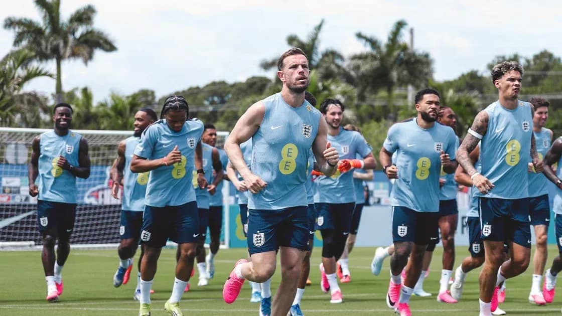 England team jogging during training session on pitch