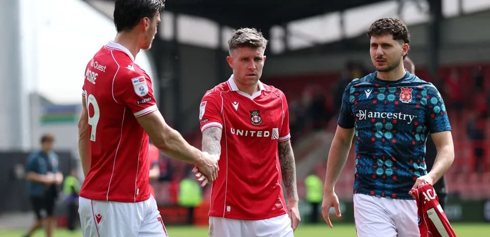 Wrexham players shaking hands after match